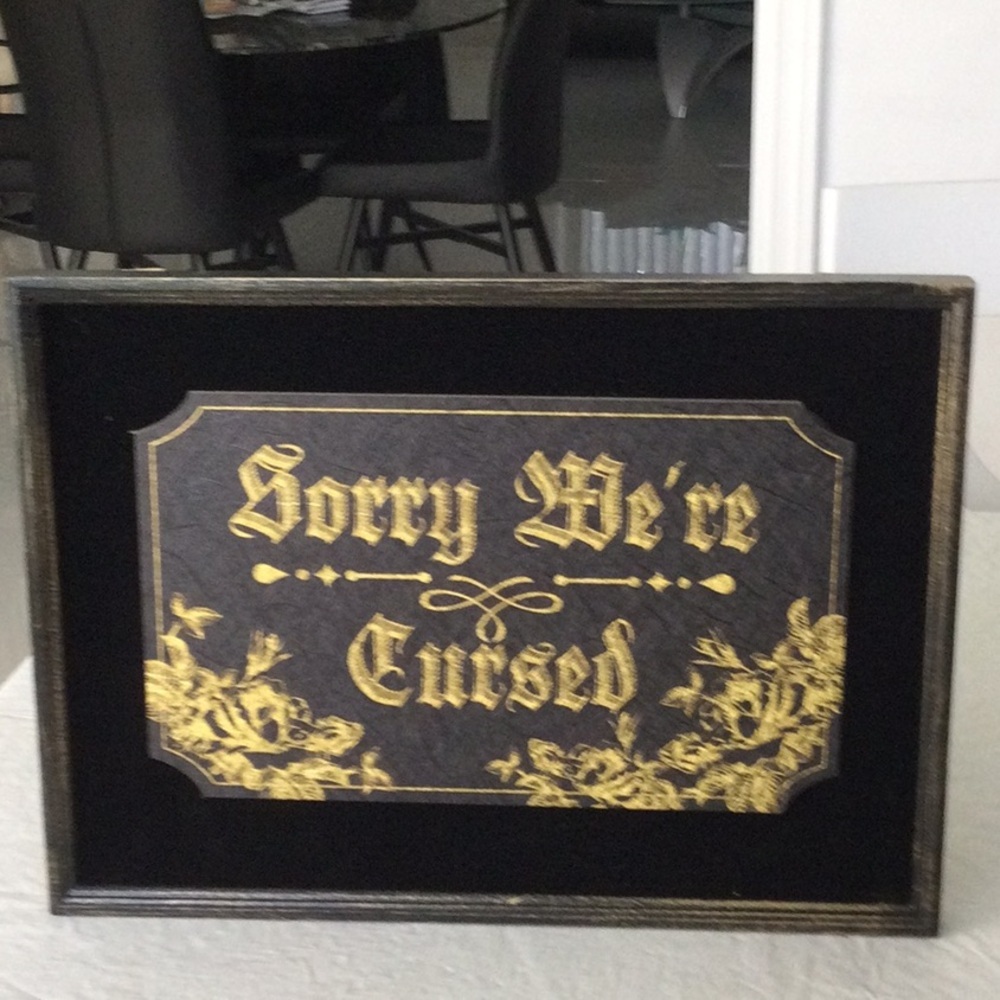 Black and Gold Decorative Sign